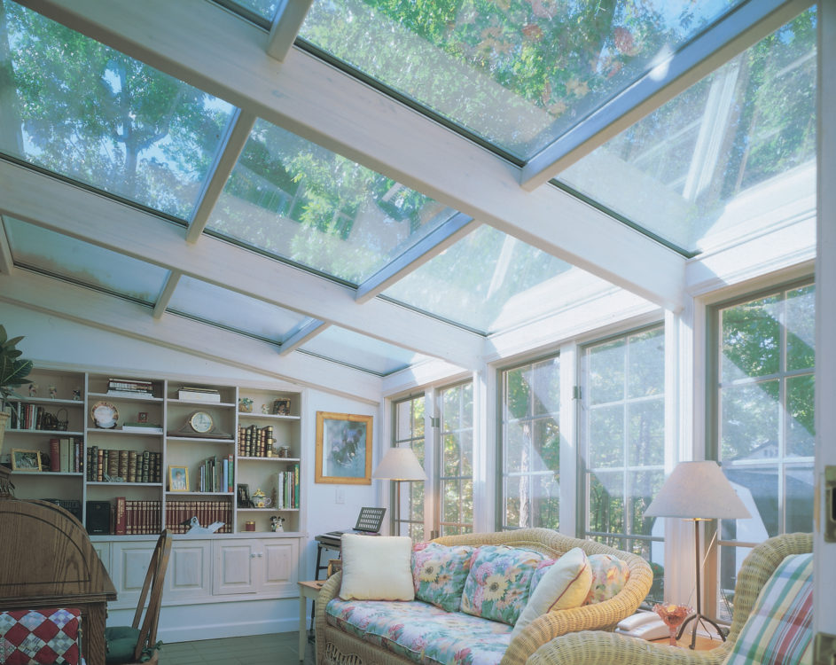 Glass straight roof sunroom with furniture & bookshelf