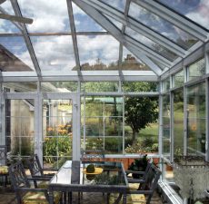 Glass conservatory sunroom with dining table
