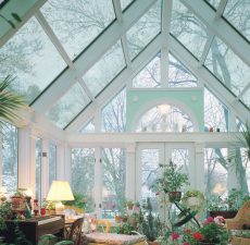 Glass cathedral sunroom decorated with plants