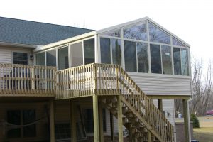 Glass cathedral sunroom on the second story