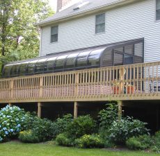 Curved eave sunroom on a deck