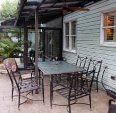 Patio table next t straight roof sunroom
