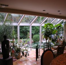 Straight roof sunroom decorated with plants