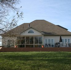 Sunroom overlooking a deck