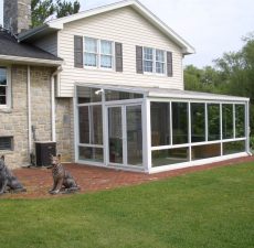Glass straight roof sunroom addition