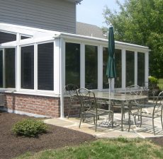 Straight roof sunroom with patio outside