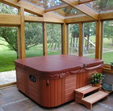 Glass straight roof sunroom to enclose a hot tub