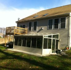 Glass straight roof sunroom addition