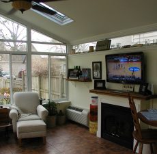 closer indoor view of solid cathedral roof sunroom addition