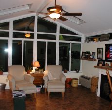 indoor view of solud roof cathedral sunroom at night