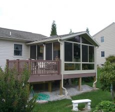 solid cathedral roof sunroom installed on deck