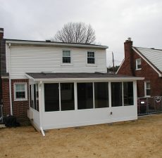 solid roof sunroom installation with straight roof