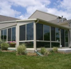 Solid roof sunroom installed back of house