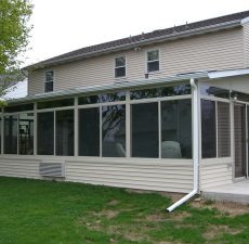 back of house solid roof sunroom installation