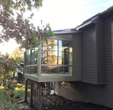 mounted solid roof sunroom house extension