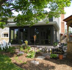 Patio enclosure besides a garden & pond