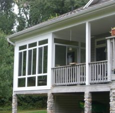 Patio enclosure that opens to a deck
