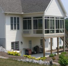 Second floor patio enclosure with open patio beneath