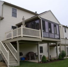 Second story enclosed patio with outdoor space beneath