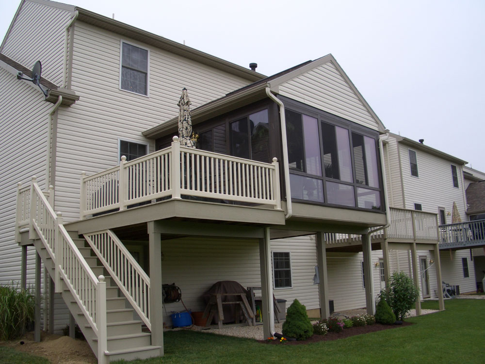 Second story enclosed patio with outdoor space beneath